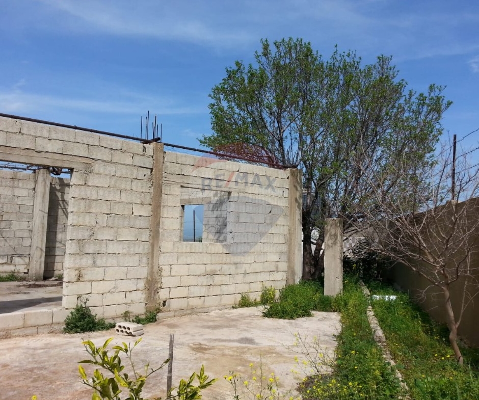 R9-613 Land for Sale in Qsair Akkar – 1,750 m²,Exclusive Price أرض للبيع في القصير عكار – 1,750 متر مربع، سعر حصري — Photo 11 of 13