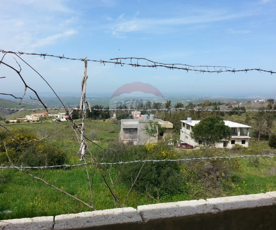 R9-613 Land for Sale in Qsair Akkar – 1,750 m²,Exclusive Price أرض للبيع في القصير عكار – 1,750 متر مربع، سعر حصري — Photo 5 of 13