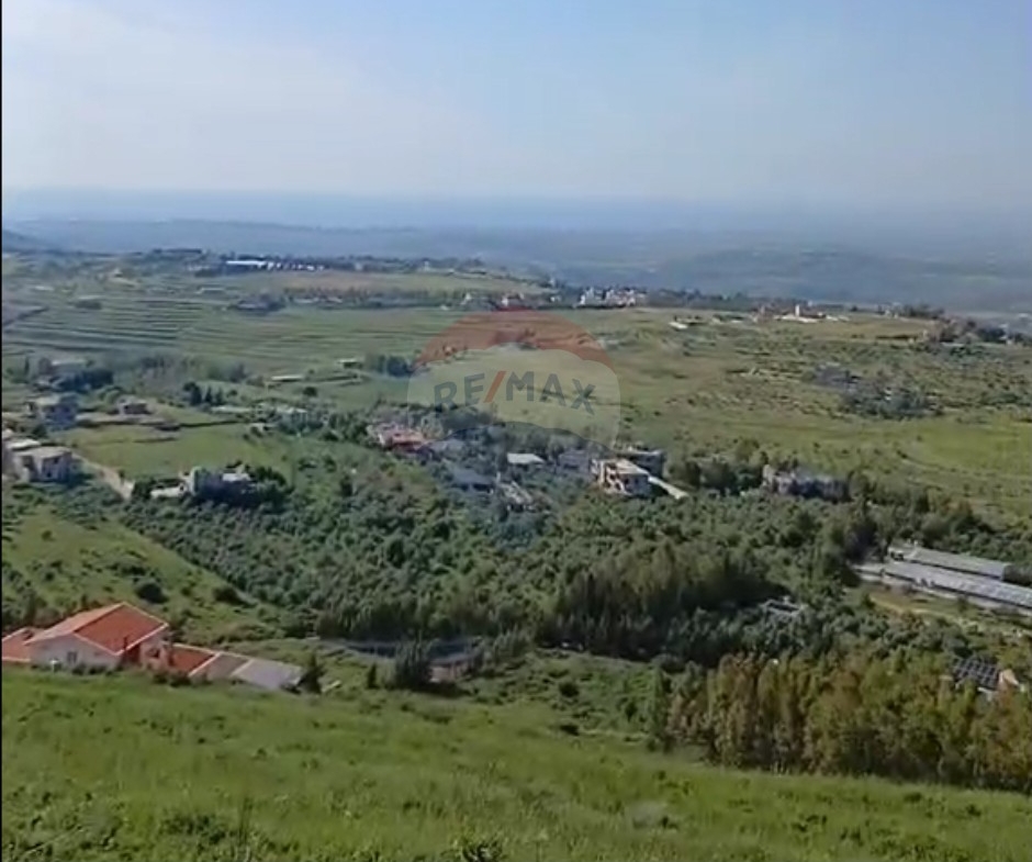 R9-3678 Two Lands for Sale in Bireh – Akkar, 2 Connected Plots, 5500 m² Each, Panoramic View قطعتا أرض متصلتان للبيع في بيريه عكار، 5500 م² لكل واحدة، إطلالة بانورامية — Photo 3 of 3