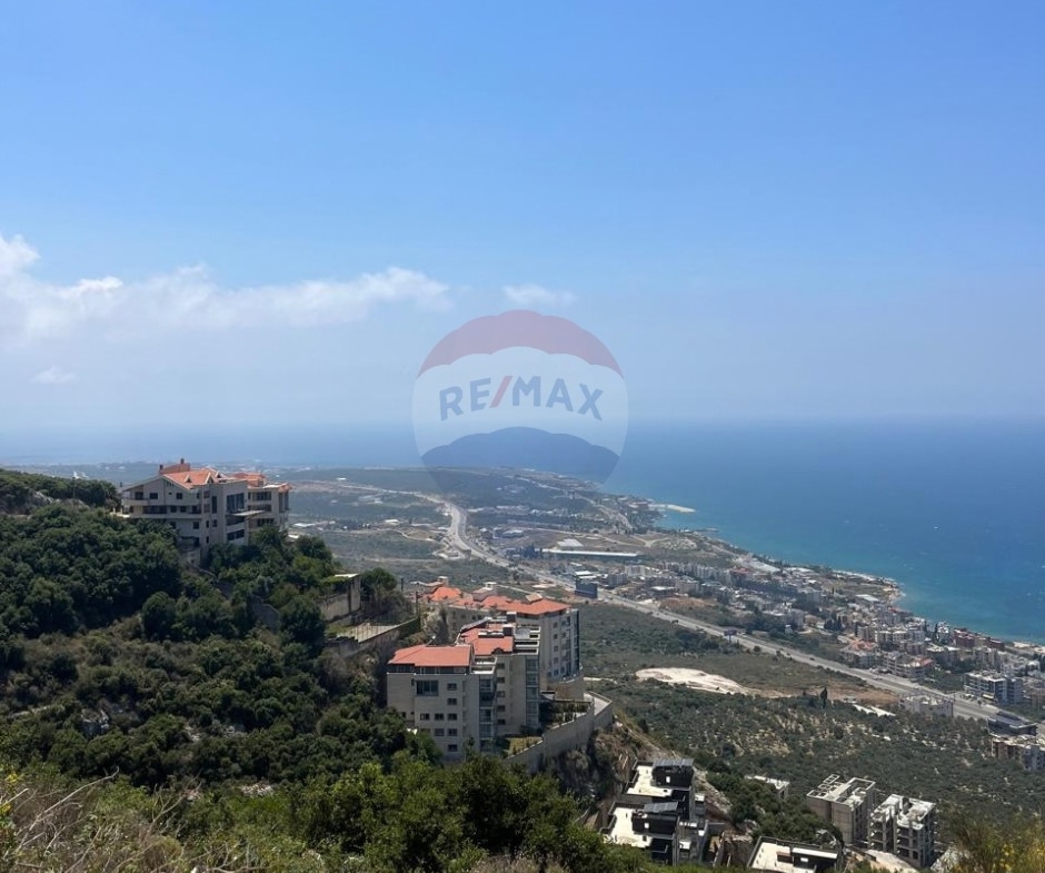R9-3961 أرض سكنية 1200م² للبيع في دده الكورة | إطلالة بحرية وجبلية — الصورة 2 من 4